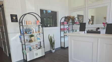Elegant reception area at The Spa Bar in Manchester, New Hampshire, US showcasing beauty products and modern decor.