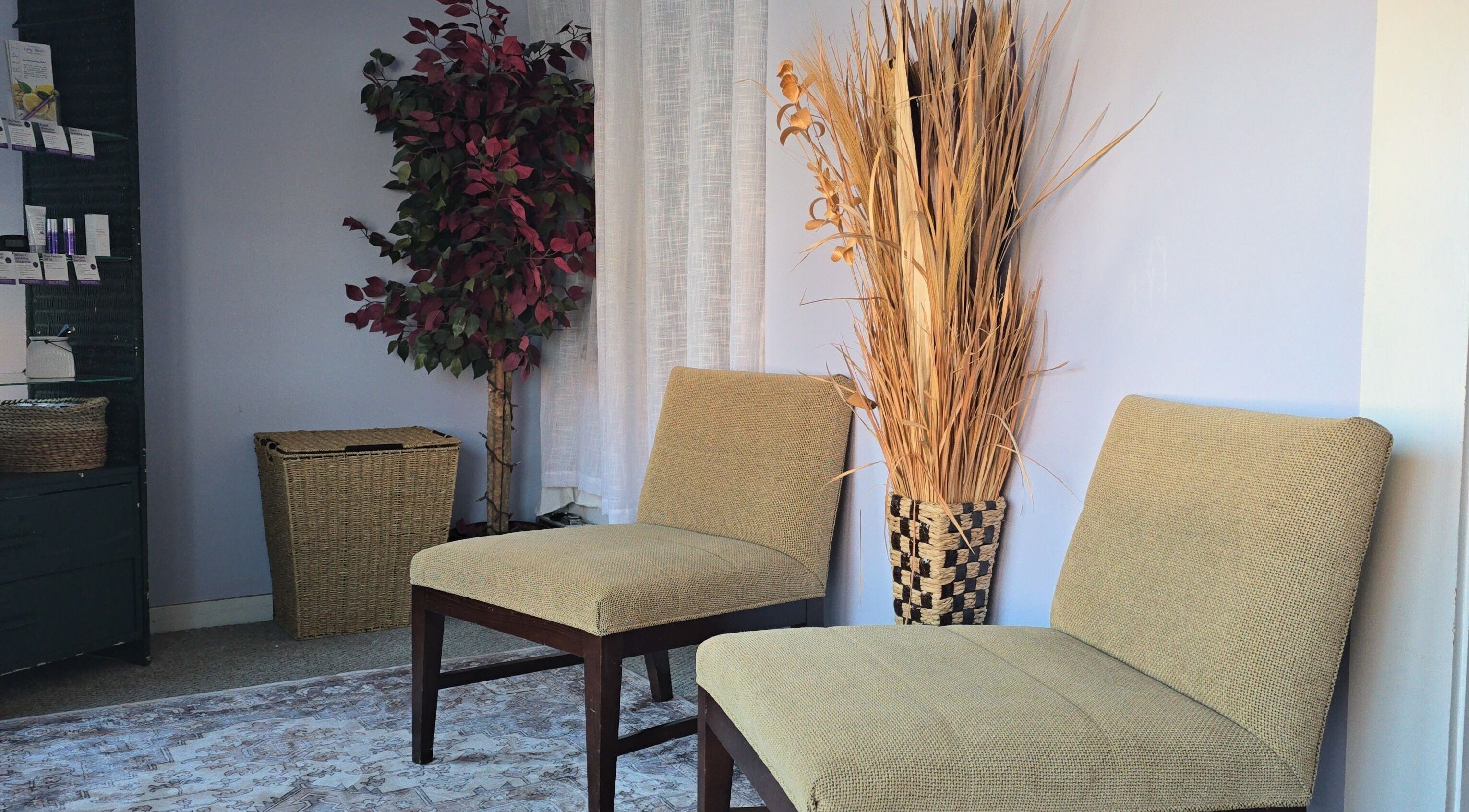 Inviting waiting area at Rooted on Main, Concord, New Hampshire, with chairs and decor.