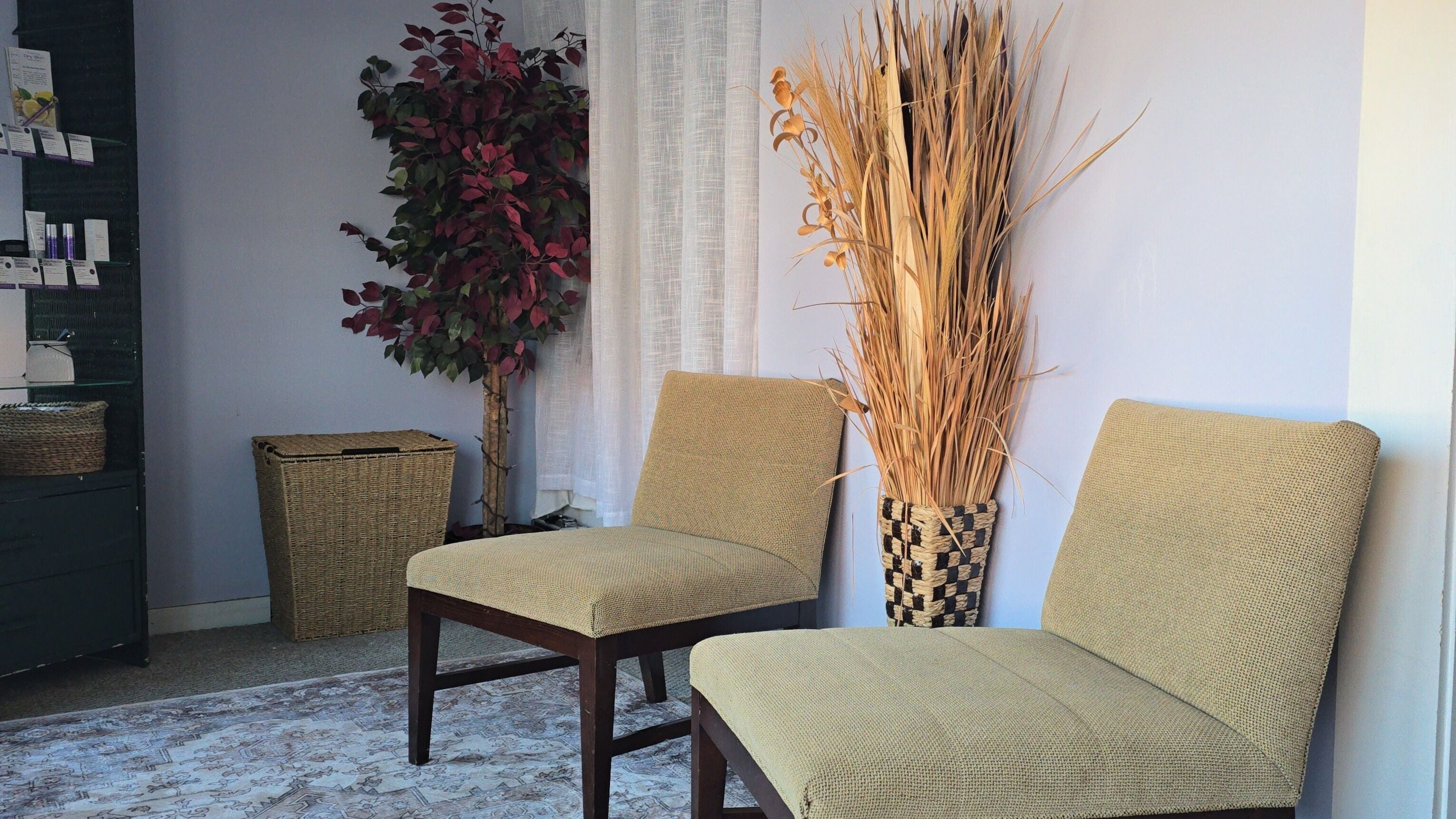 Inviting waiting area at Rooted on Main, Concord, New Hampshire, with chairs and decor.