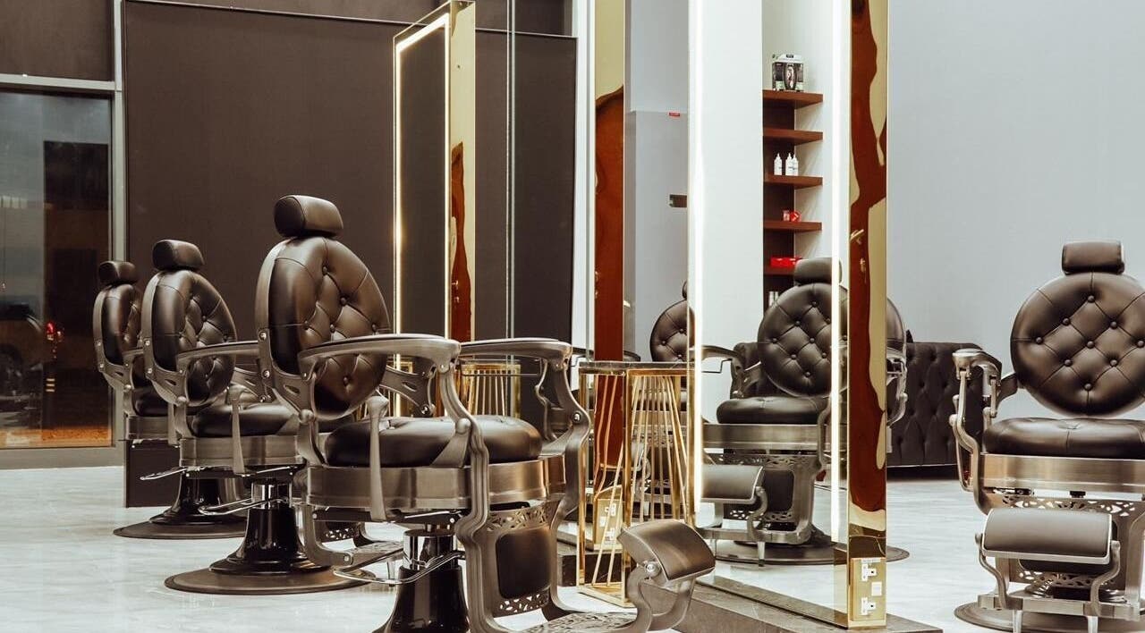 Elegant barber chairs at Barber Siva Gents Salon, Dubai, AE highlight sophistication and comfort.