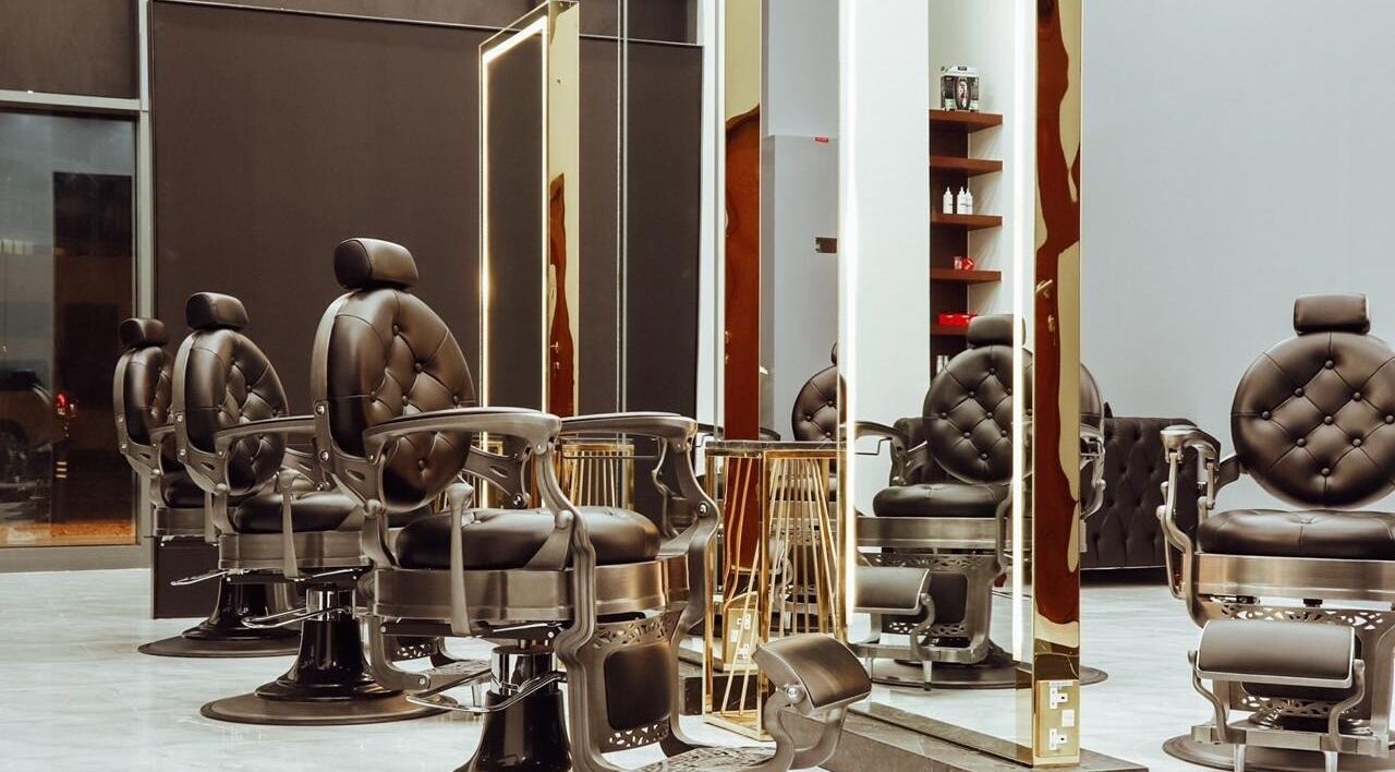 Elegant barber chairs at Barber Siva Gents Salon, Dubai, AE highlight sophistication and comfort.