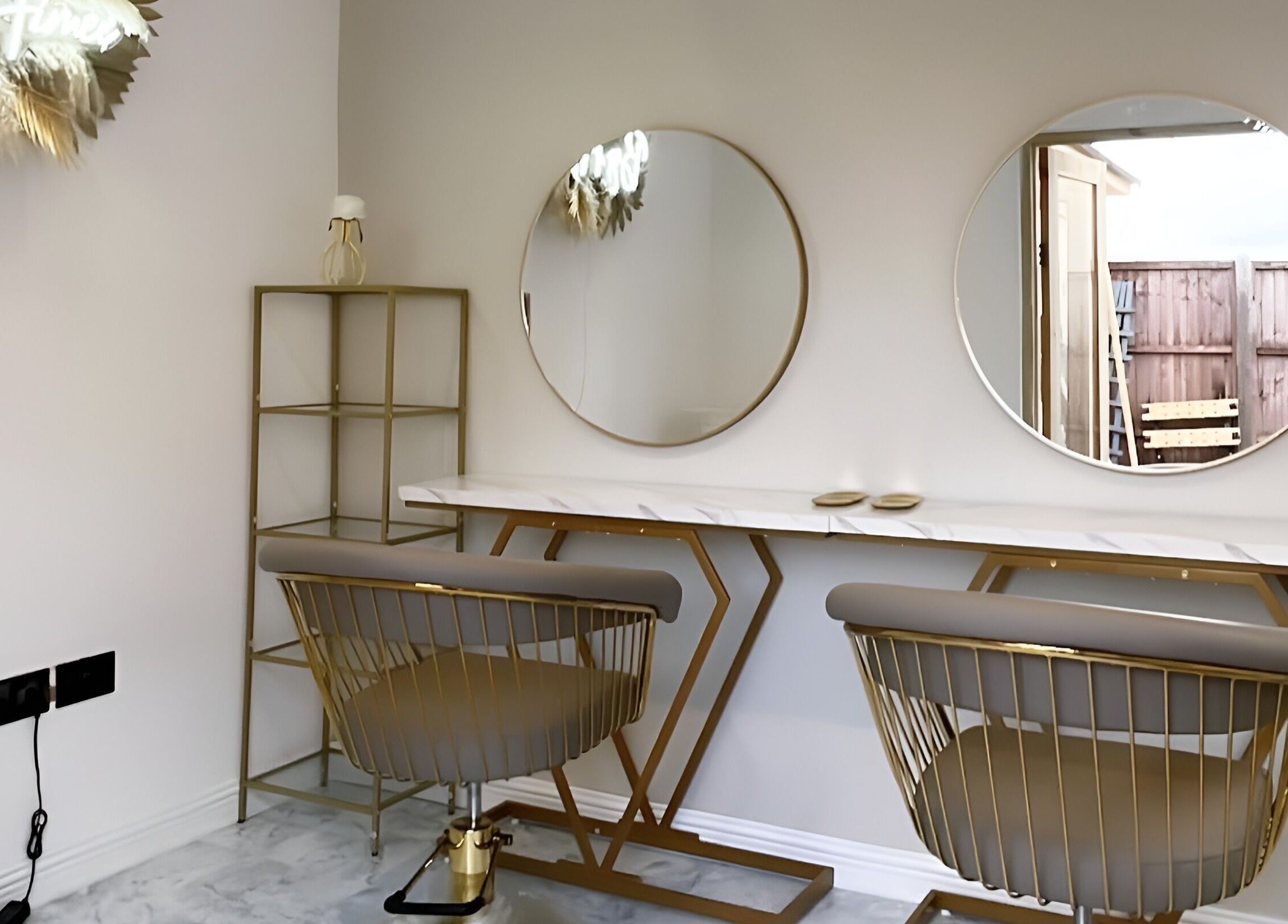 Chic styling area at Hair by Aimee in Hatfield, England, GB with modern mirrors and sleek chairs.