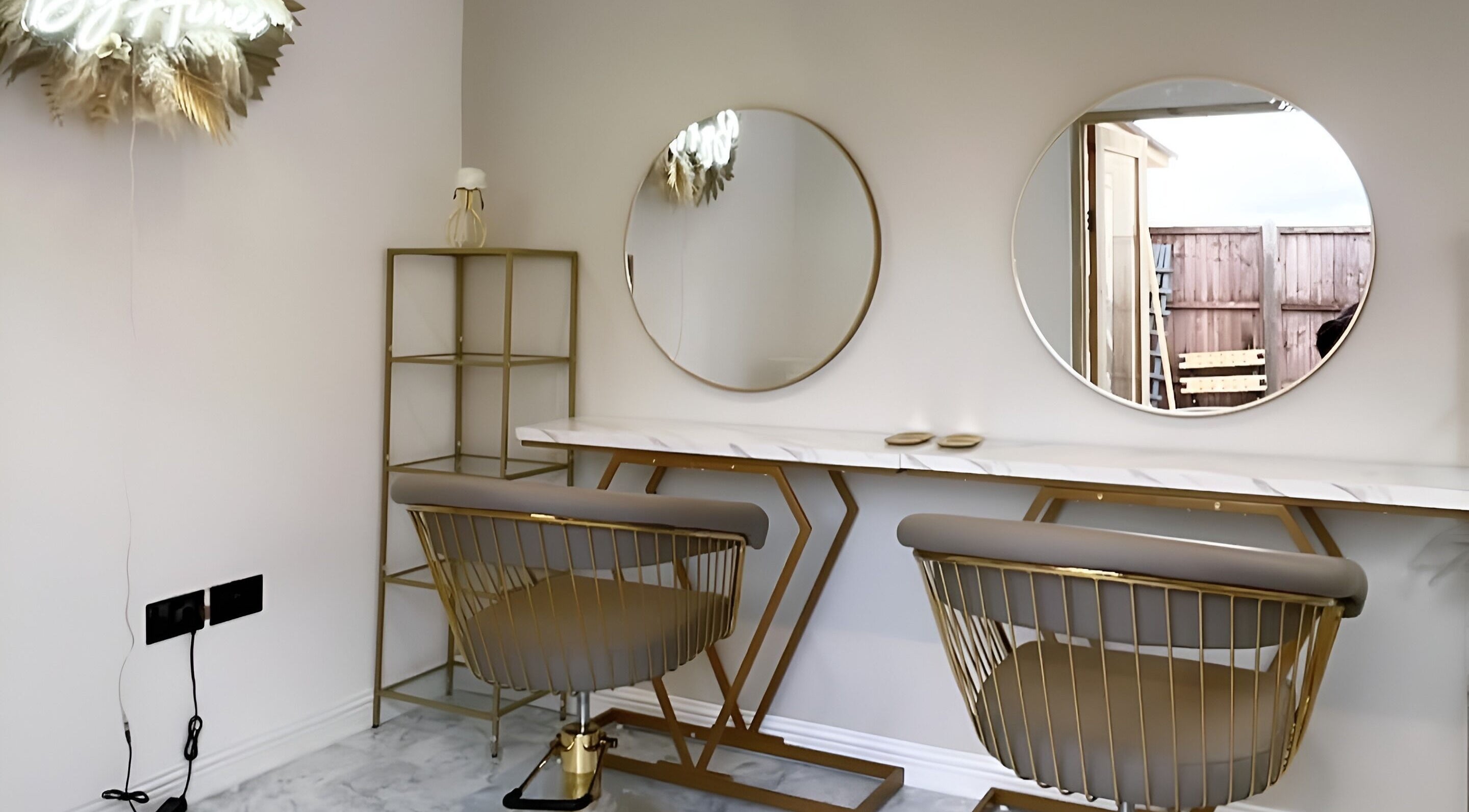 Chic styling area at Hair by Aimee in Hatfield, England, GB with modern mirrors and sleek chairs.