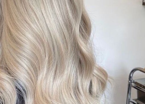 Luscious blonde waves styled at Hair by Aimee in Hatfield, England, GB, highlighting silky smooth hair.