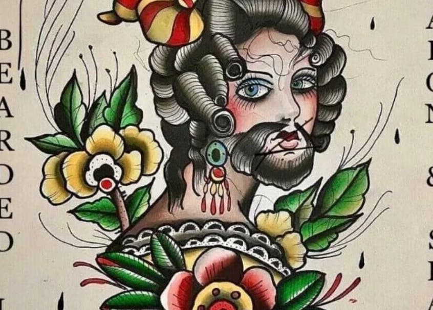 Artistic salon sign at The Bearded Lady Salon, Fernandina Beach, Florida, US. Vibrant floral and vintage design.