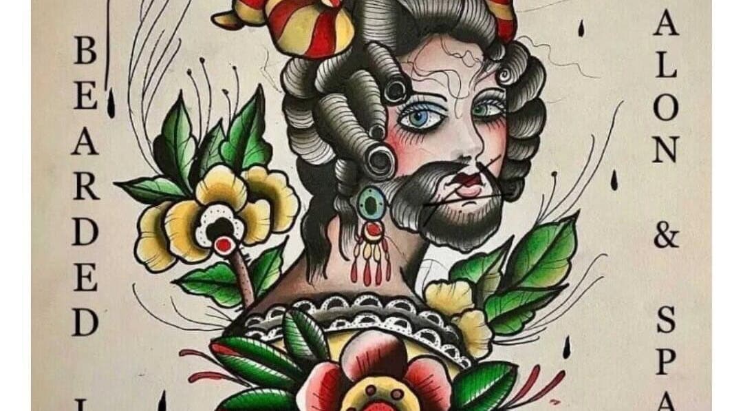 Artistic salon sign at The Bearded Lady Salon, Fernandina Beach, Florida, US. Vibrant floral and vintage design.