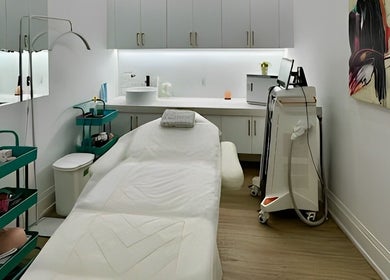 Modern spa treatment room at Skin Cave Beauty, Mississauga, Ontario, CA featuring a cozy bed and stylish decor.