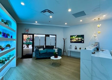Elegant reception area of Skin Cave Beauty in Mississauga, Ontario, CA with modern decor and soothing lighting.