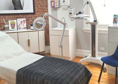 Elegant treatment room at Mayfair Rejuvenation Clinic, Williamstown, Victoria, AU with comfy chair and equipment.