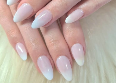 Elegant ombré nails at Titivate Nail & Spray Tan Studio, Somerset West, Western Cape, ZA on a soft background.