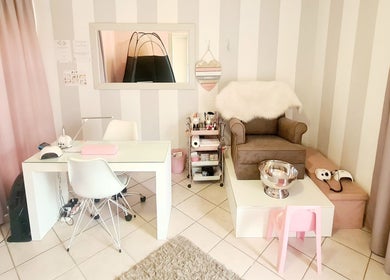 Elegant workspace at Titivate Nail & Spray Tan Studio in Somerset West, Western Cape, ZA with cozy seating.