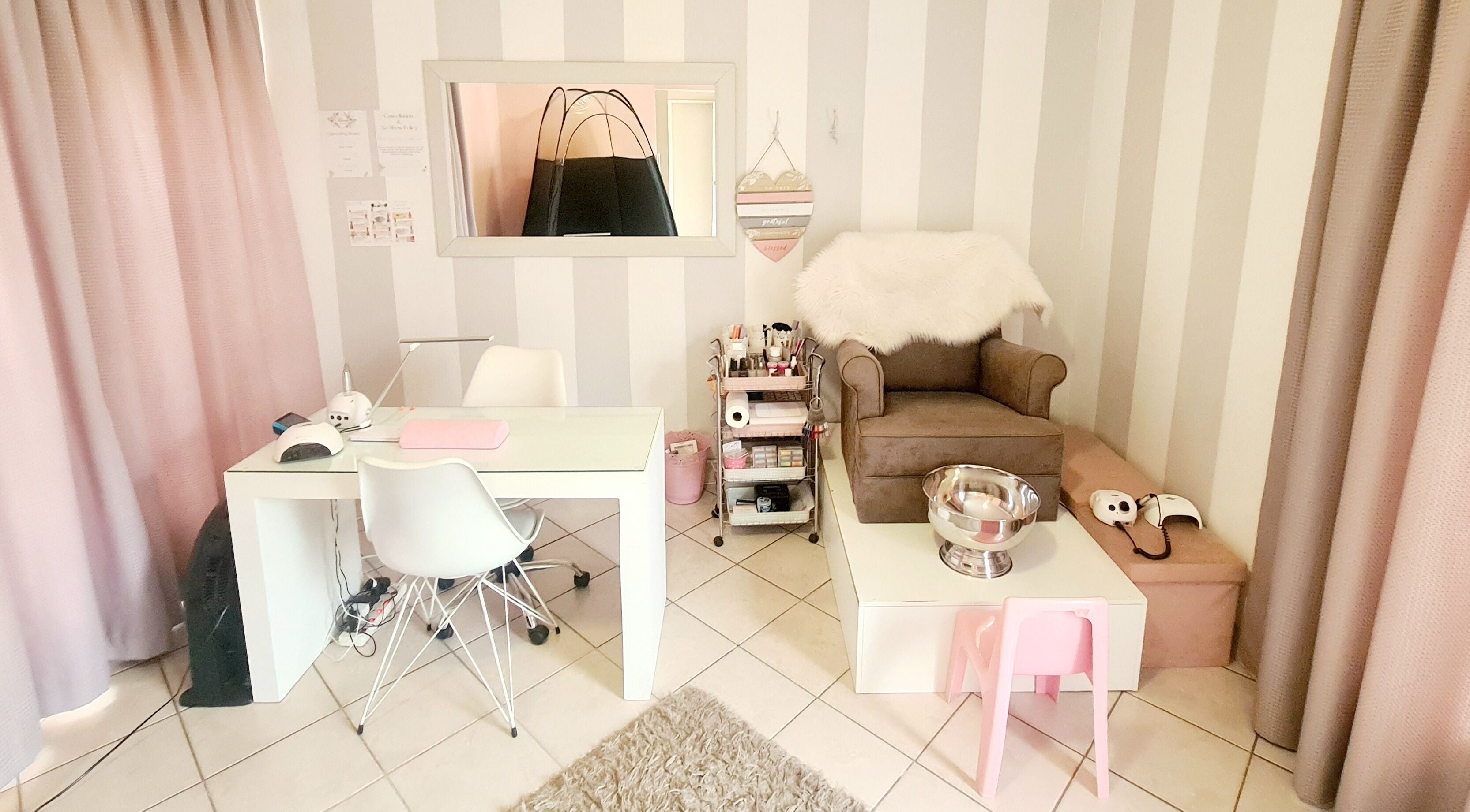 Elegant workspace at Titivate Nail & Spray Tan Studio in Somerset West, Western Cape, ZA with cozy seating.