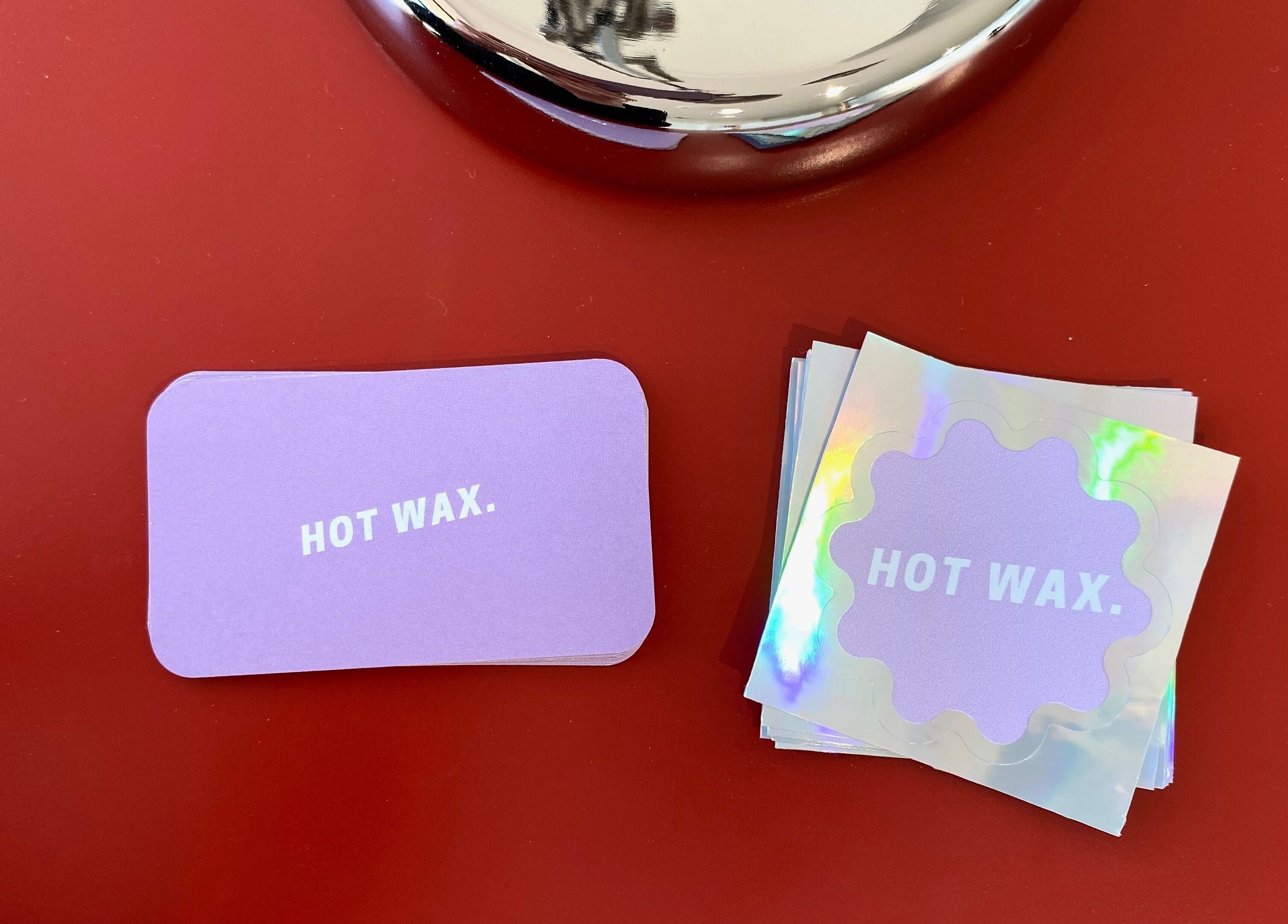 Hot Wax branding cards in vibrant display at Wembley, Western Australia, AU venue.