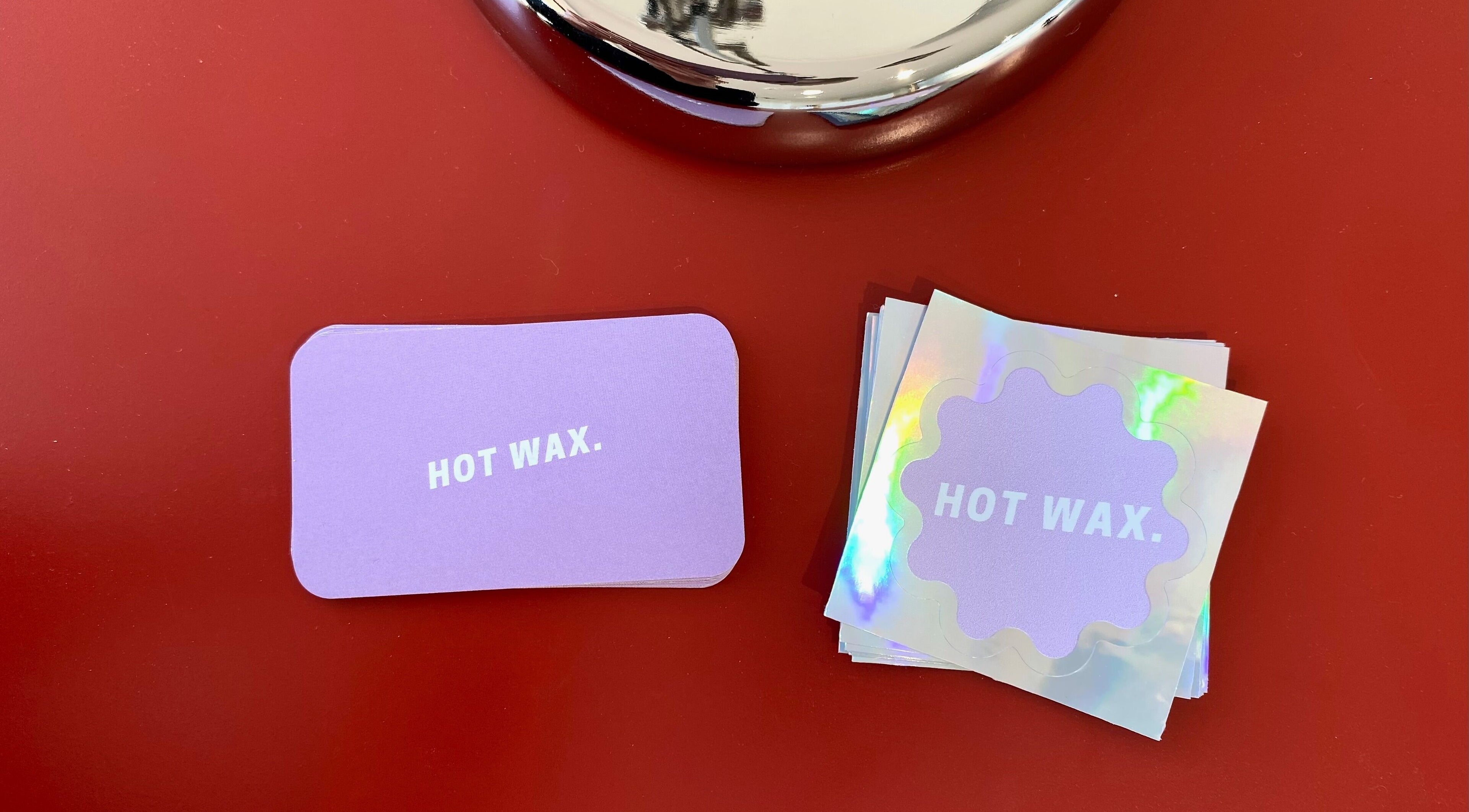 Hot Wax branding cards in vibrant display at Wembley, Western Australia, AU venue.