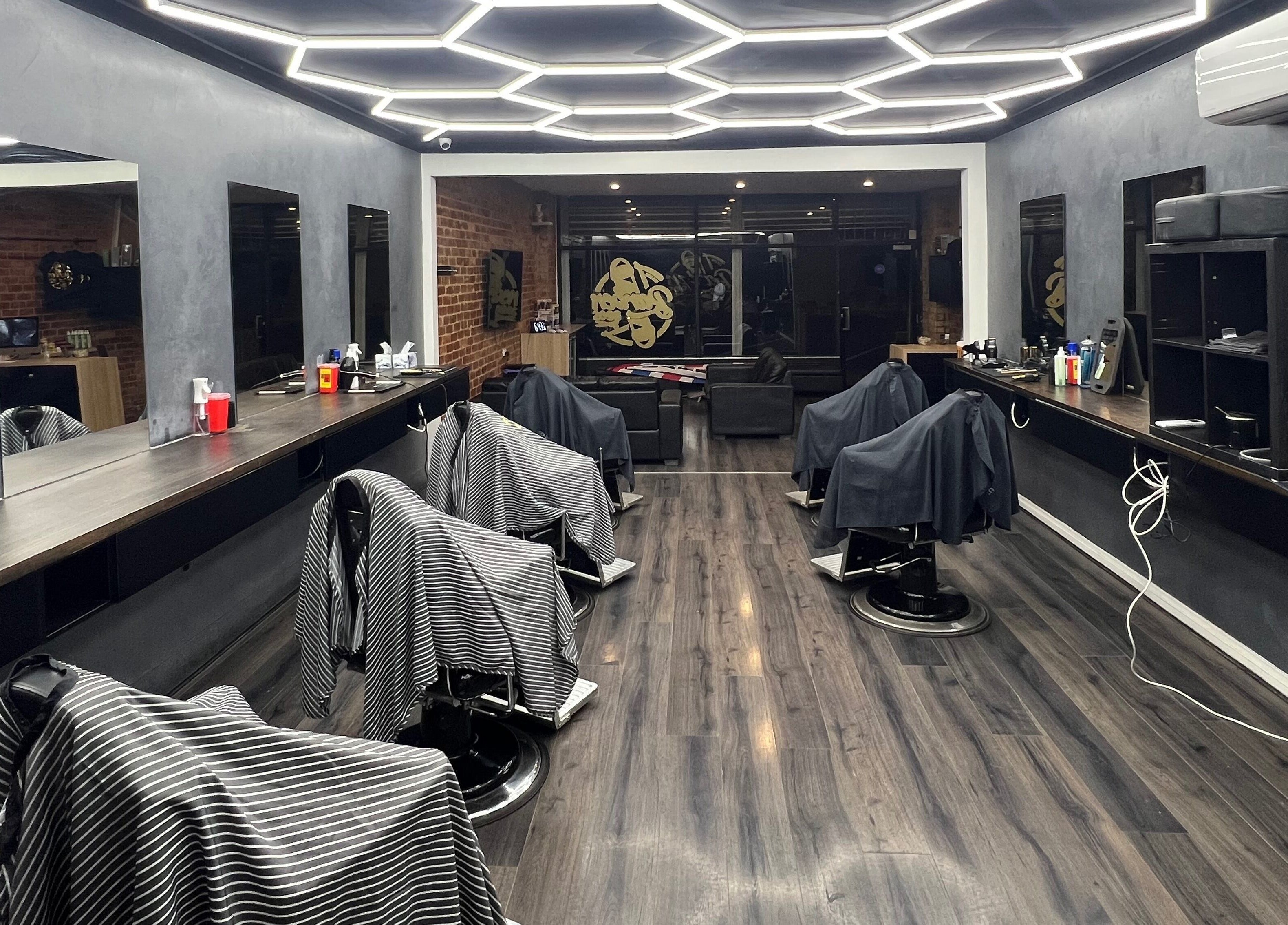 Modern barber interior at Barber Bros, Melbourne, Victoria, AU with stylish decor and multiple chairs.