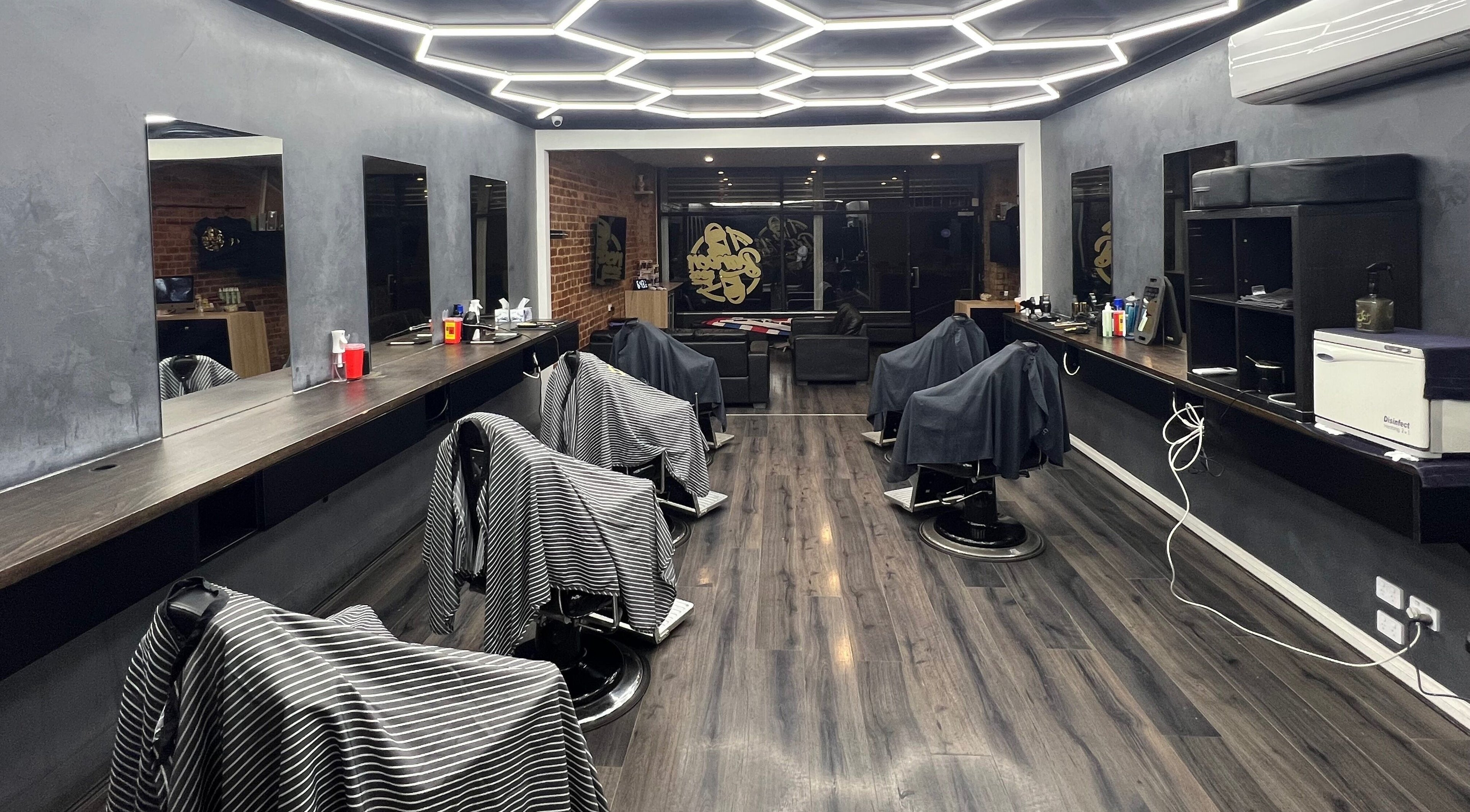 Modern barber interior at Barber Bros, Melbourne, Victoria, AU with stylish decor and multiple chairs.
