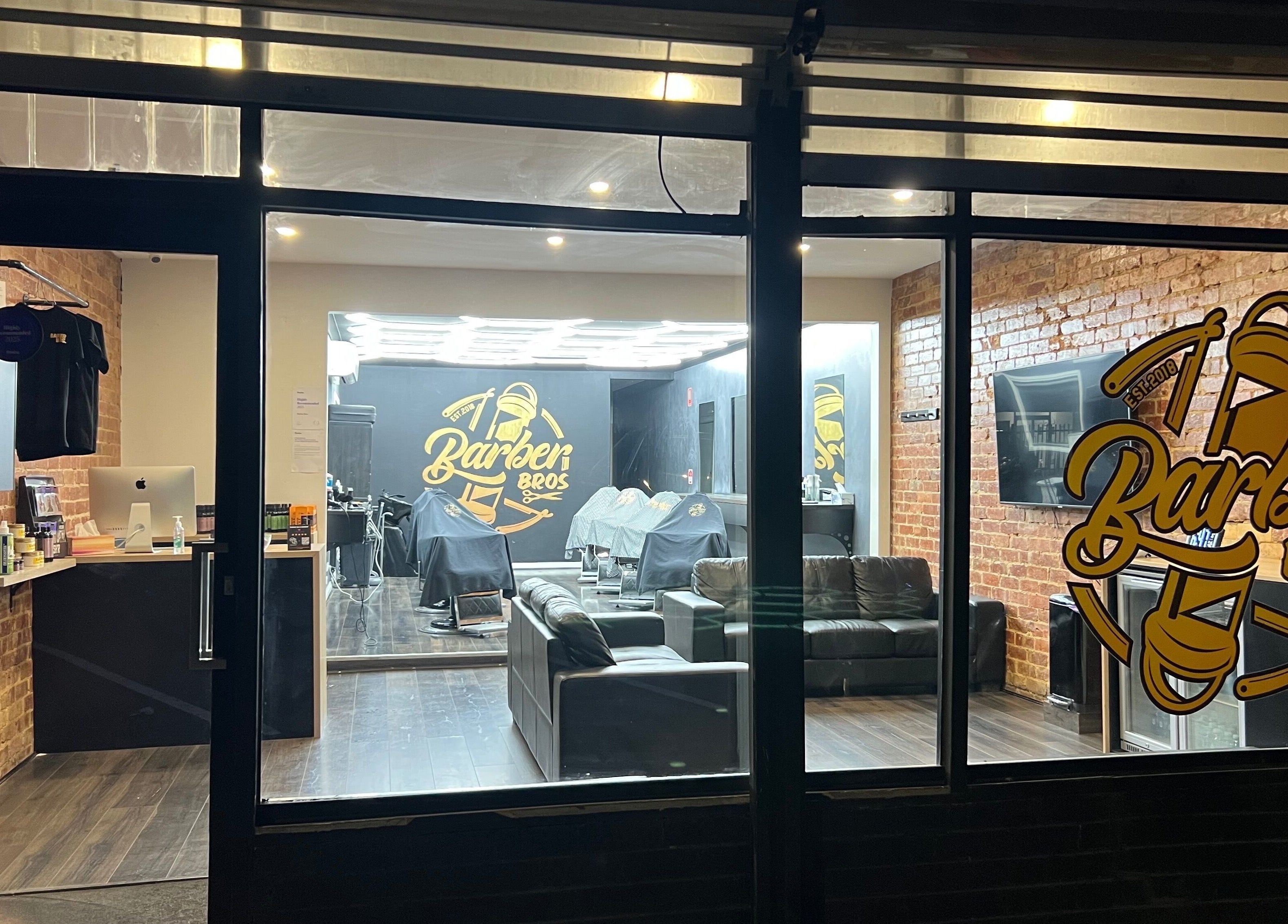 Barber Bros interior view in Melbourne, Victoria, AU, showcasing modern chairs and stylish decor.
