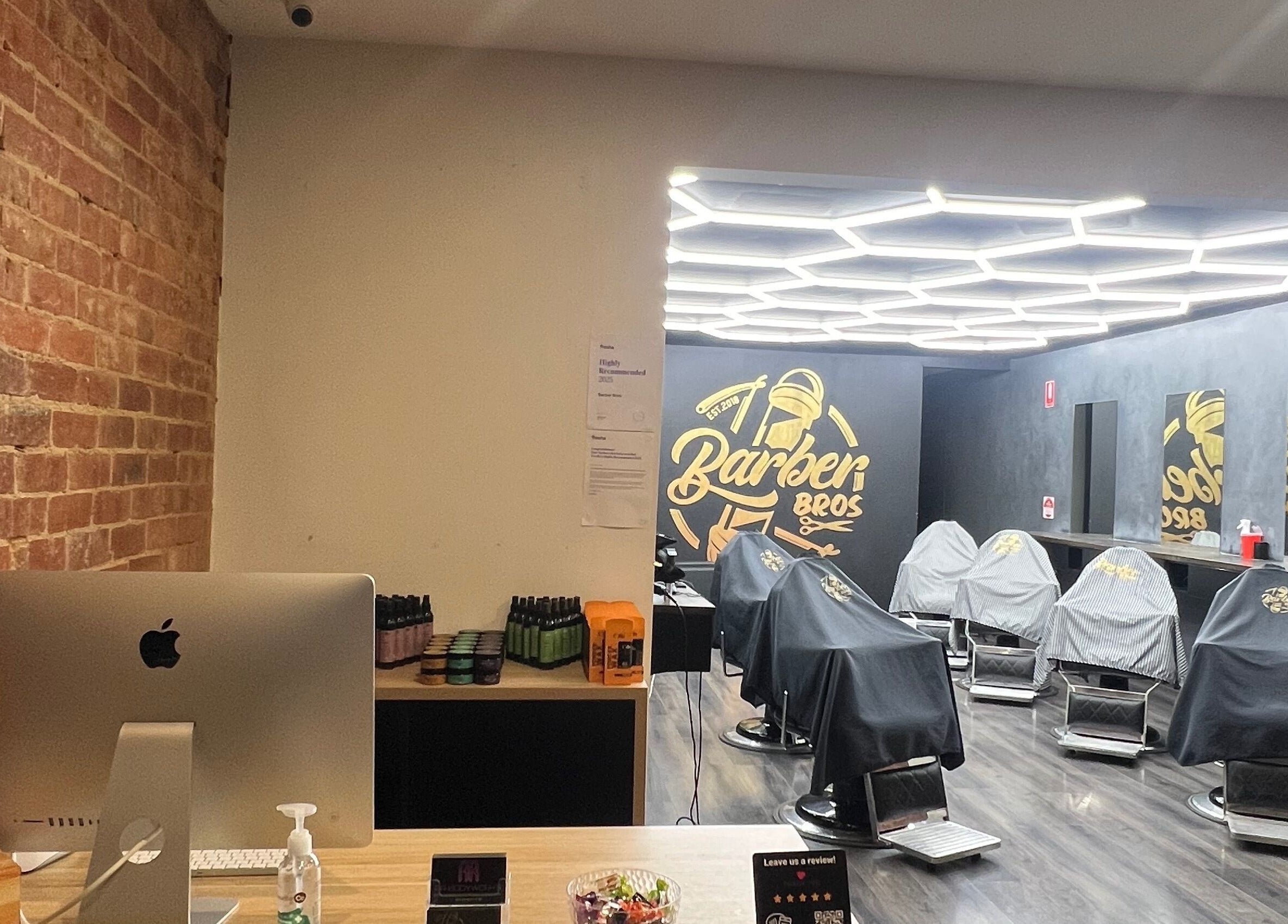 Modern interior of Barber Bros at Melbourne, Victoria, AU with sleek chairs and stylish decor.