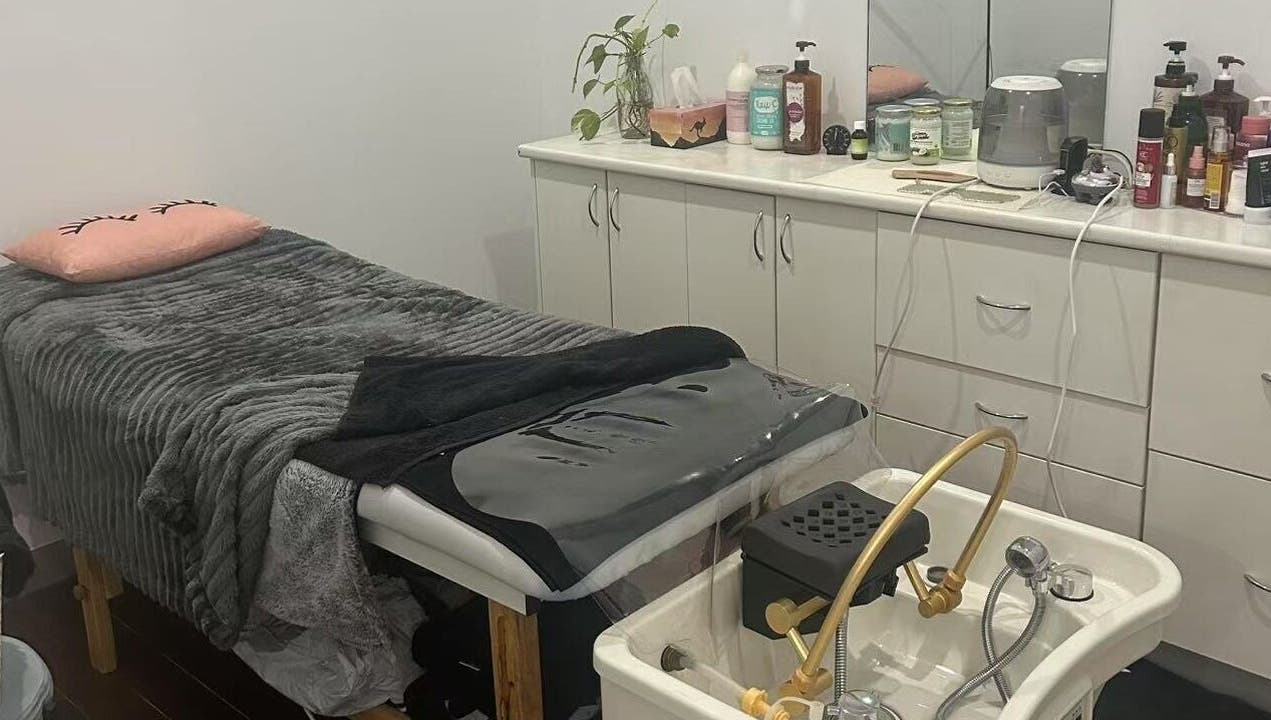Cozy treatment room at MB Luxury Spa Castletown, Hyde Park, Queensland, AU showcasing a plush massage table.