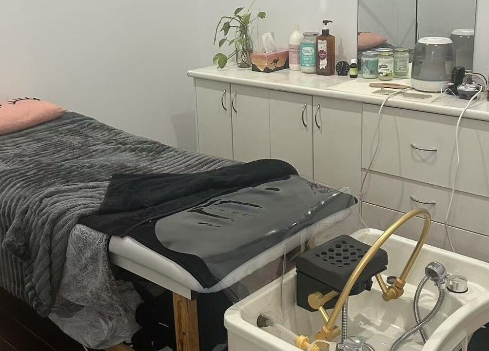 Cozy treatment room at MB Luxury Spa Castletown, Hyde Park, Queensland, AU showcasing a plush massage table.