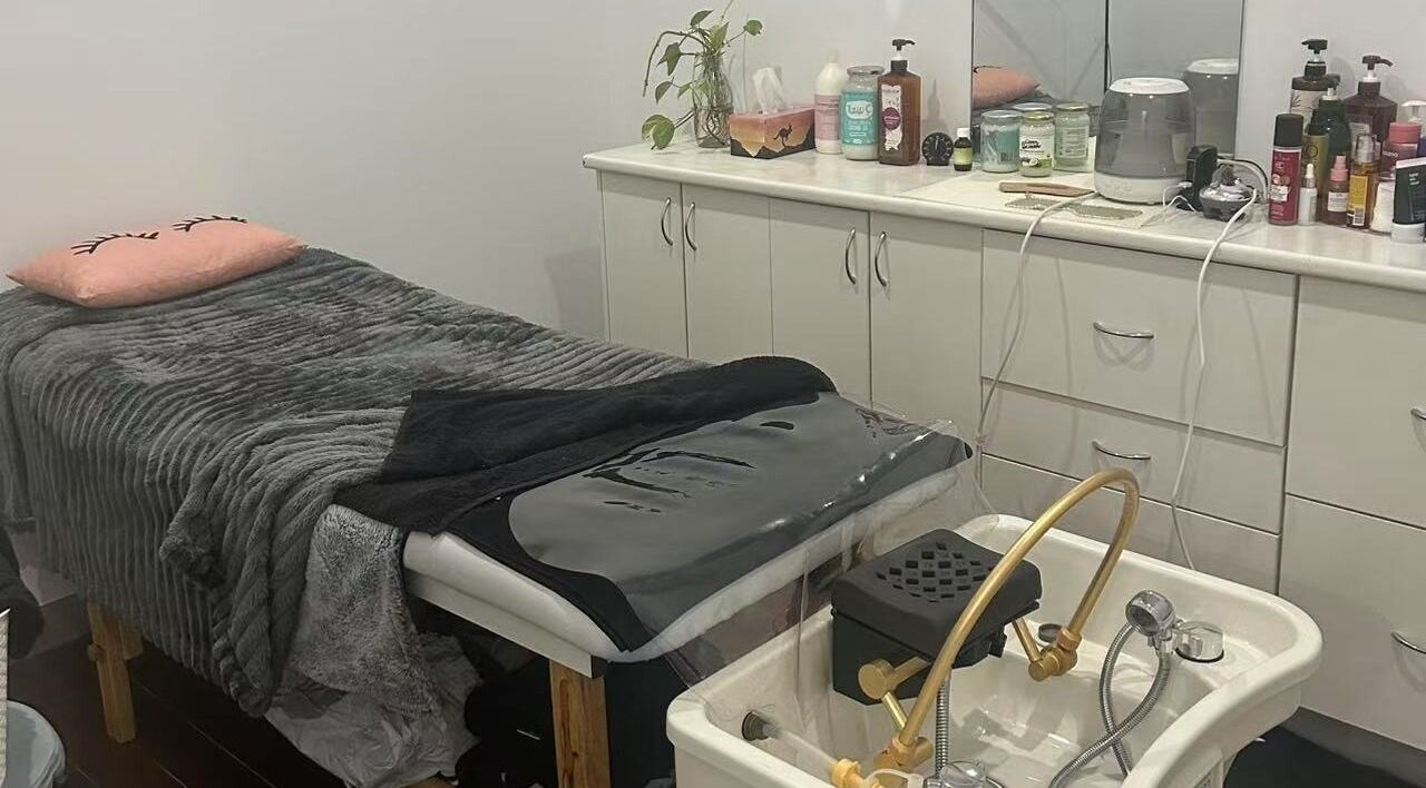 Cozy treatment room at MB Luxury Spa Castletown, Hyde Park, Queensland, AU showcasing a plush massage table.