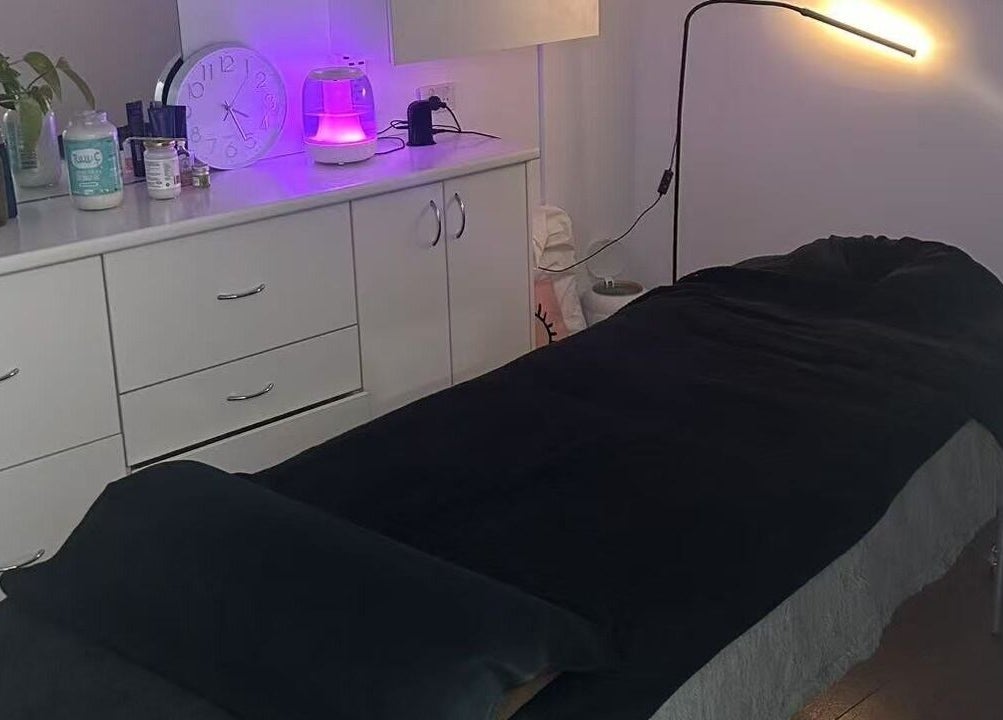 Cozy treatment room at MB Luxury Spa Castletown, Hyde Park, Queensland, AU with ambient lighting and modern decor.