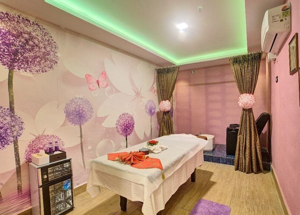 Luxurious massage room at Hasta Spa Tada in Tada, Andhra Pradesh, IN with elegant floral decor.