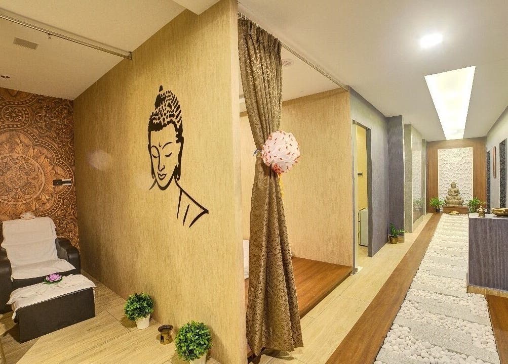 Relaxing interior of Hasta Spa Tada in Tada, Andhra Pradesh, IN with a calming decor and Buddha mural.