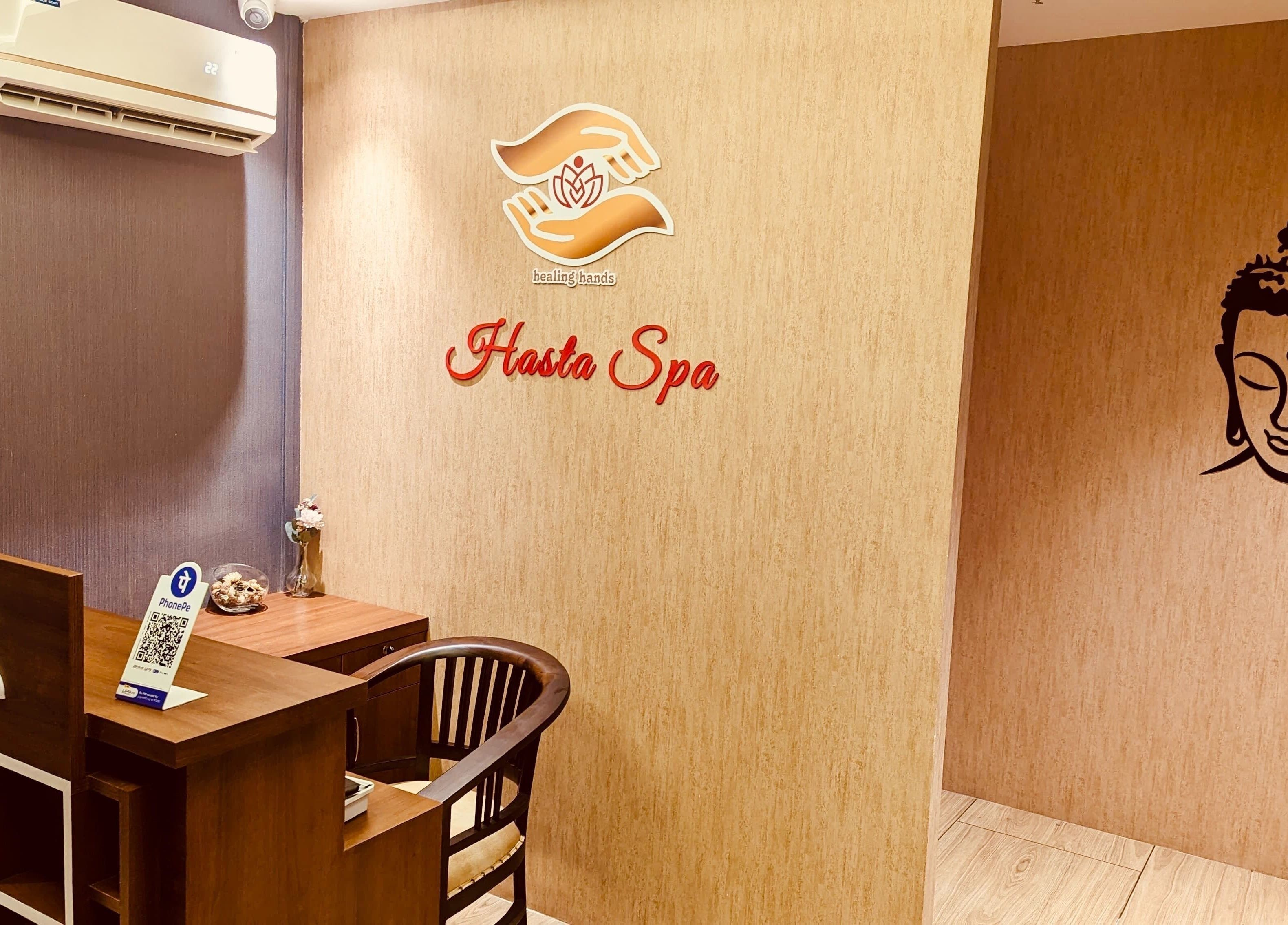 Reception area of Hasta Spa Tada in Tada, Andhra Pradesh, IN, featuring a serene Buddha mural.