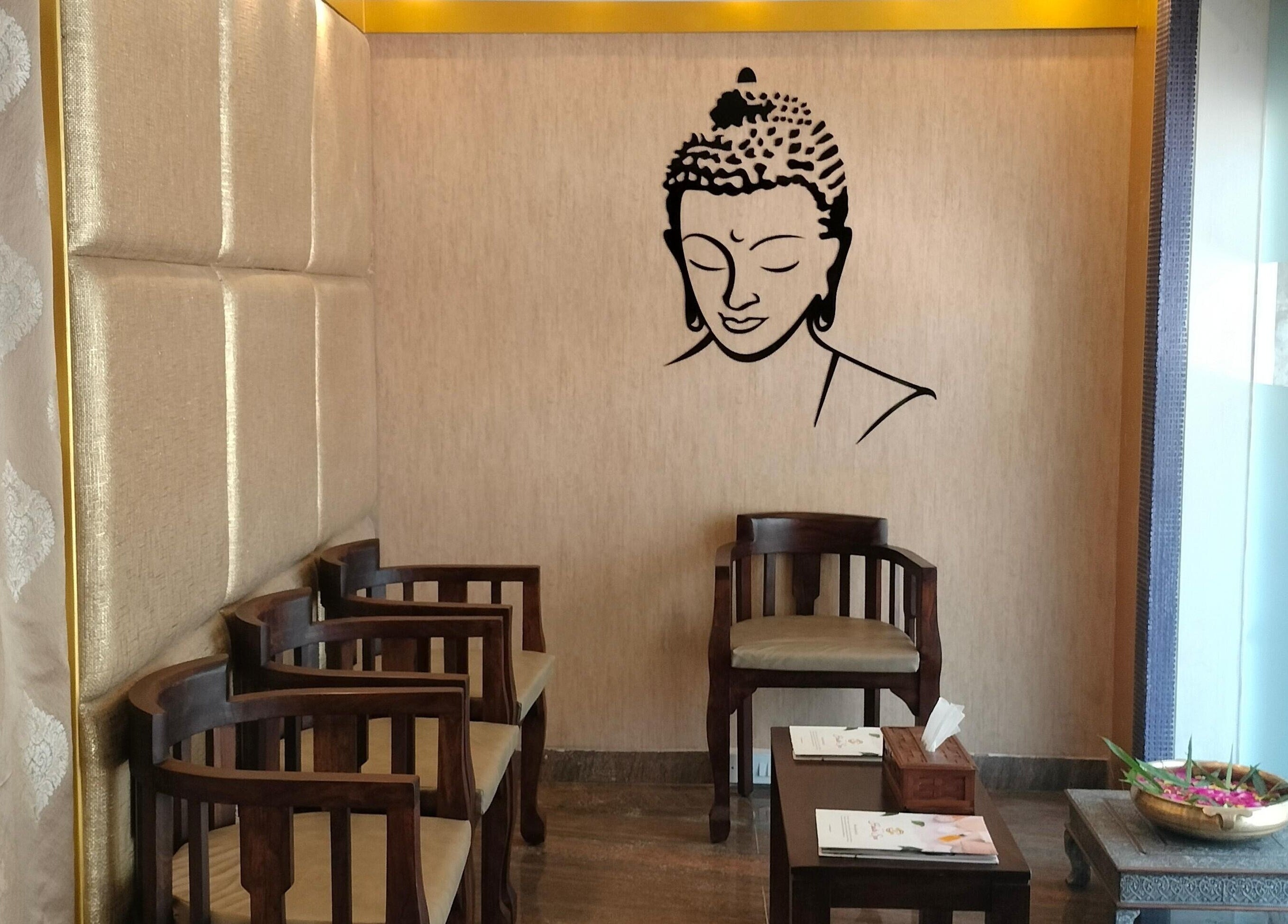 Elegant seating area with Buddha art at Hasta Spa Besant Nagar, Chennai, Tamil Nadu, IN.