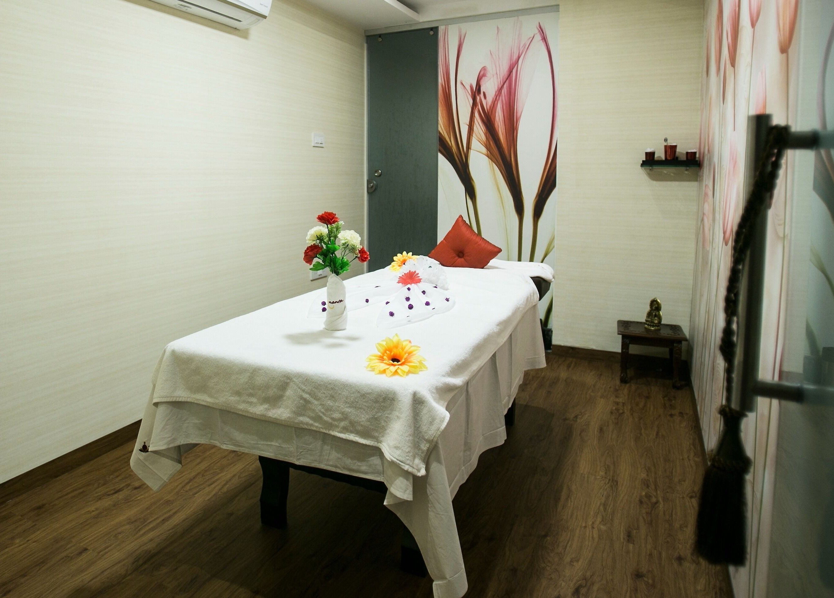 Luxury massage room at Hasta Spa Virugambakkam, Chennai, Tamil Nadu, IN, with elegant decor and cozy ambiance.