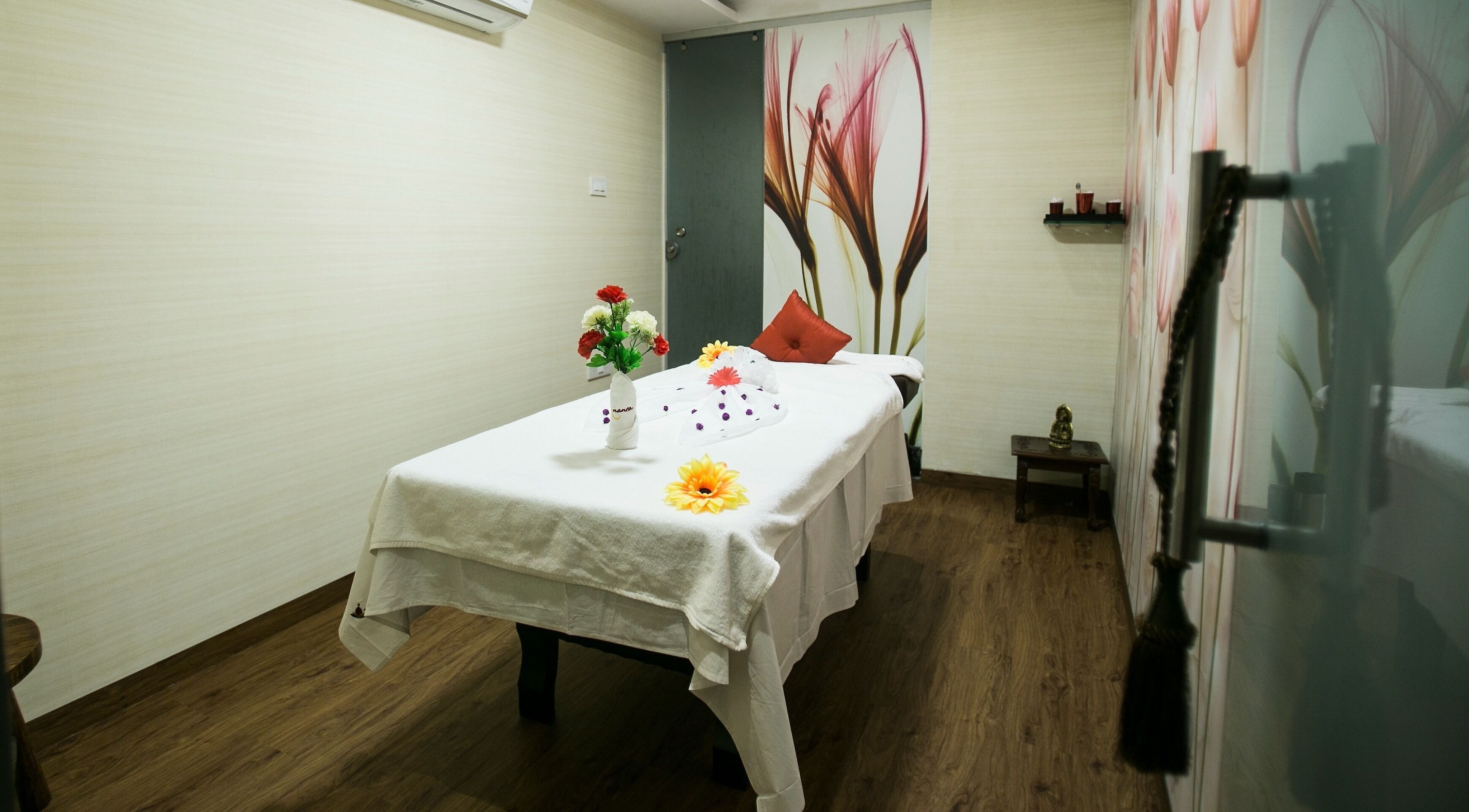 Luxury massage room at Hasta Spa Virugambakkam, Chennai, Tamil Nadu, IN, with elegant decor and cozy ambiance.