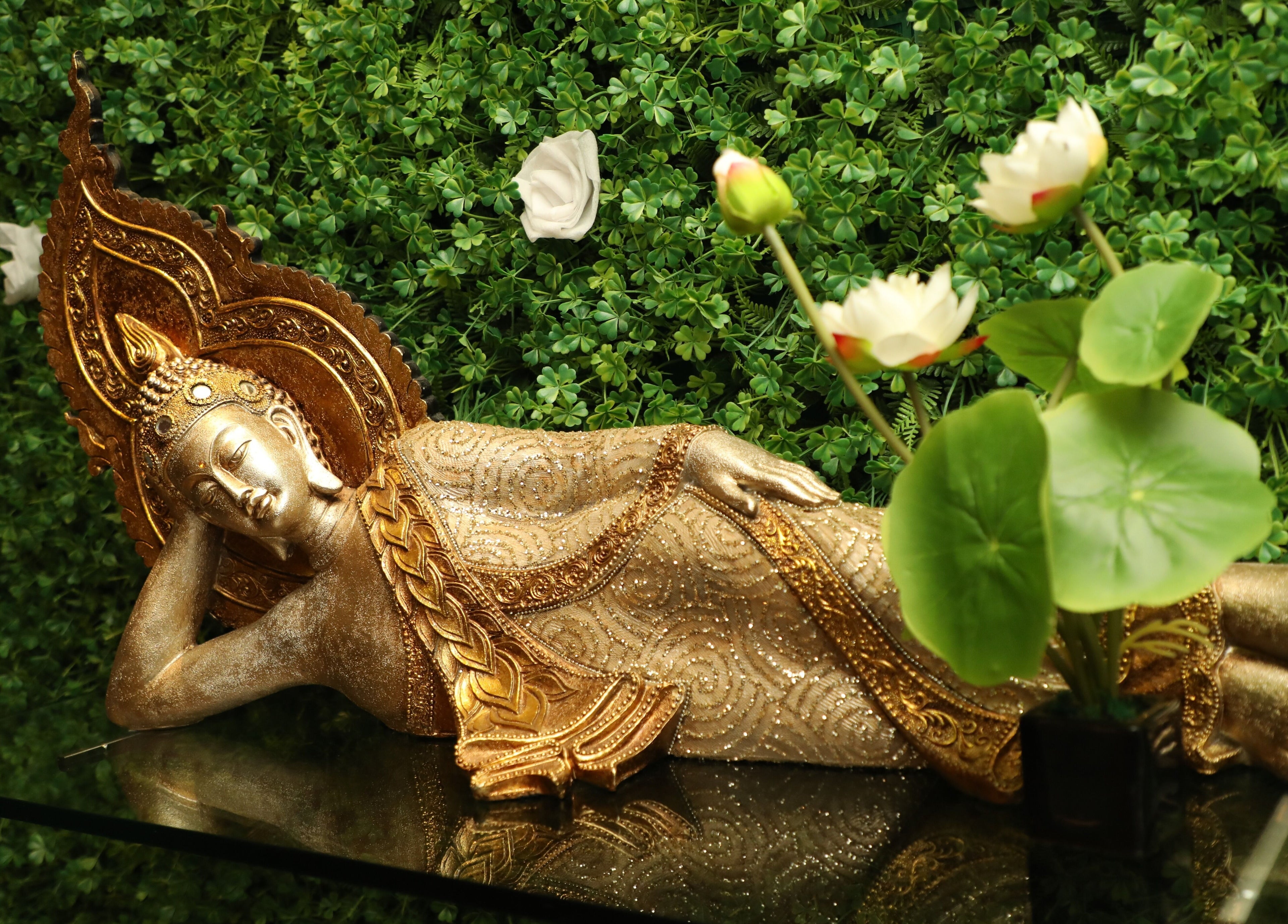 Elegant Buddha statue at Hasta Spa Virugambakkam, Chennai, Tamil Nadu, IN, enhances tranquil ambiance.