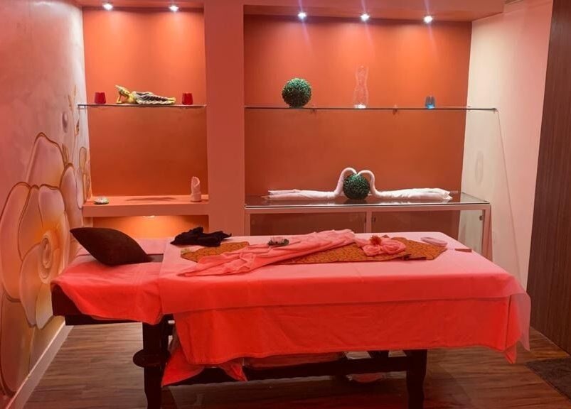 Tranquil massage room at Hasta Spa Anna Nagar in Chennai, Tamil Nadu, IN with soft lighting and decor.