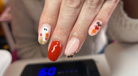 Unique nail art showcasing floral and abstract designs at Aurora Beauty in Redditch, England, GB.