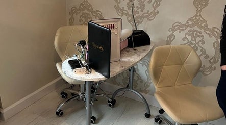 Cozy nail station setup at Aurora Beauty, Redditch, England, GB, featuring elegant chairs and tools.
