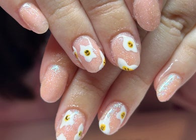 Close-up of elegant floral nail art at Aurora Beauty in Redditch, England, GB showcasing delicate designs.