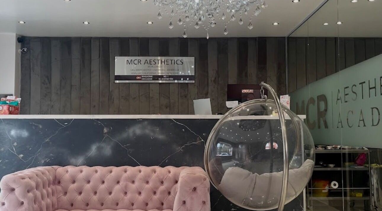 Chic reception area at Carlisle's beauty venue, Carlisle, England, GB with plush sofa and modern decor.