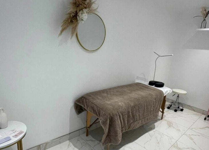 Tranquil therapy room at The Sculpted Clinic, Towcester, England, GB with a cozy treatment table.