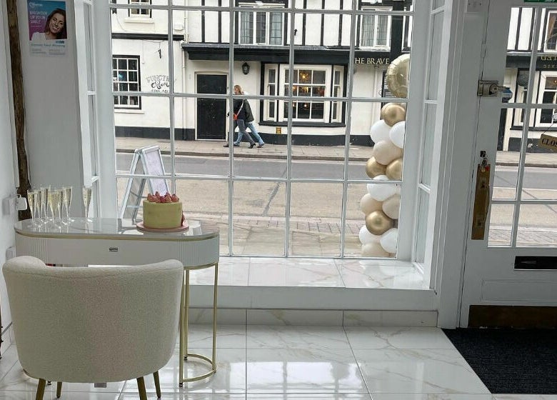 The Sculpted Clinic in towcester, England, GB features a stylish window display with a modern interior.