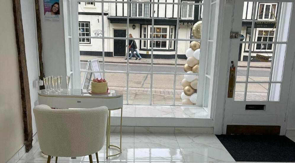 The Sculpted Clinic in towcester, England, GB features a stylish window display with a modern interior.