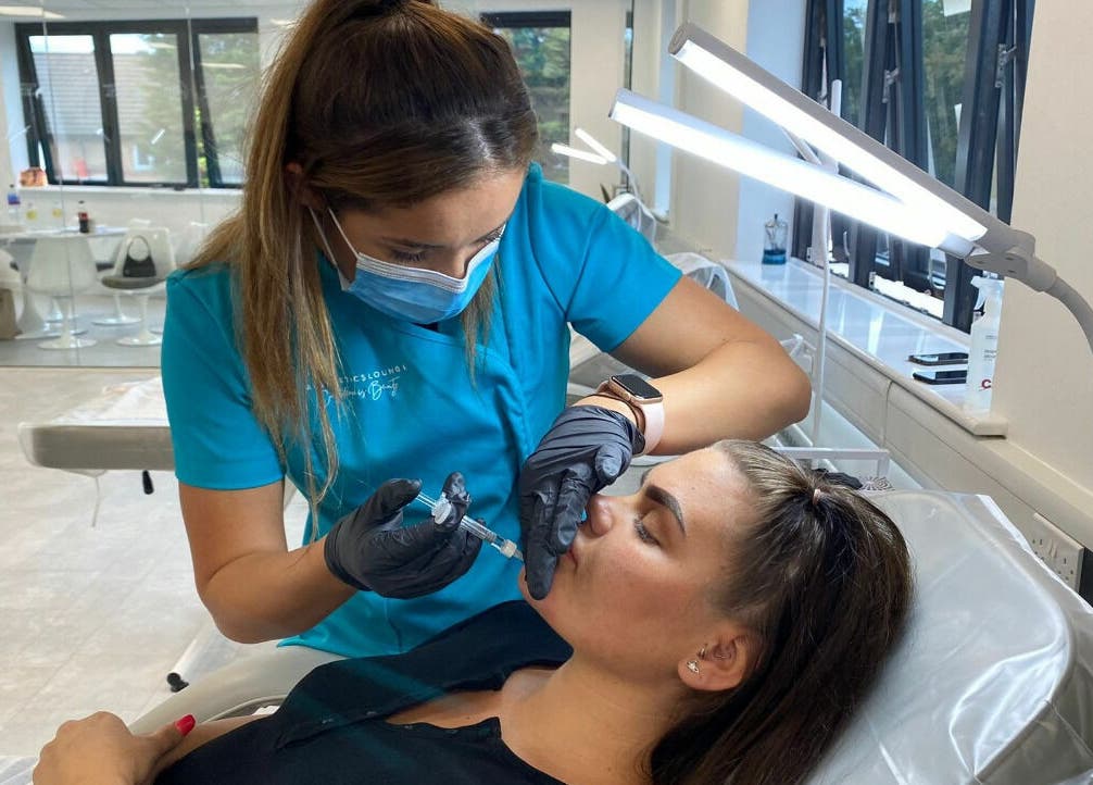 Skilled technician performing lip enhancement at The Sculpted Clinic, Towcester, England, GB.