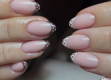 Elegant pink manicure with polka dot tips at By Emily Elizabeth, Ripley, England, GB.