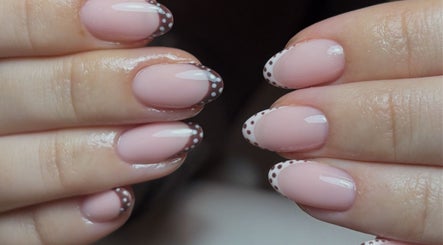 Elegant pink manicure with polka dot tips at By Emily Elizabeth, Ripley, England, GB.