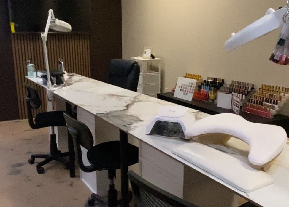 Modern nail station at Sculpted by Perla in Fort Mohave, Arizona, US, showcasing a stylish and professional setup.