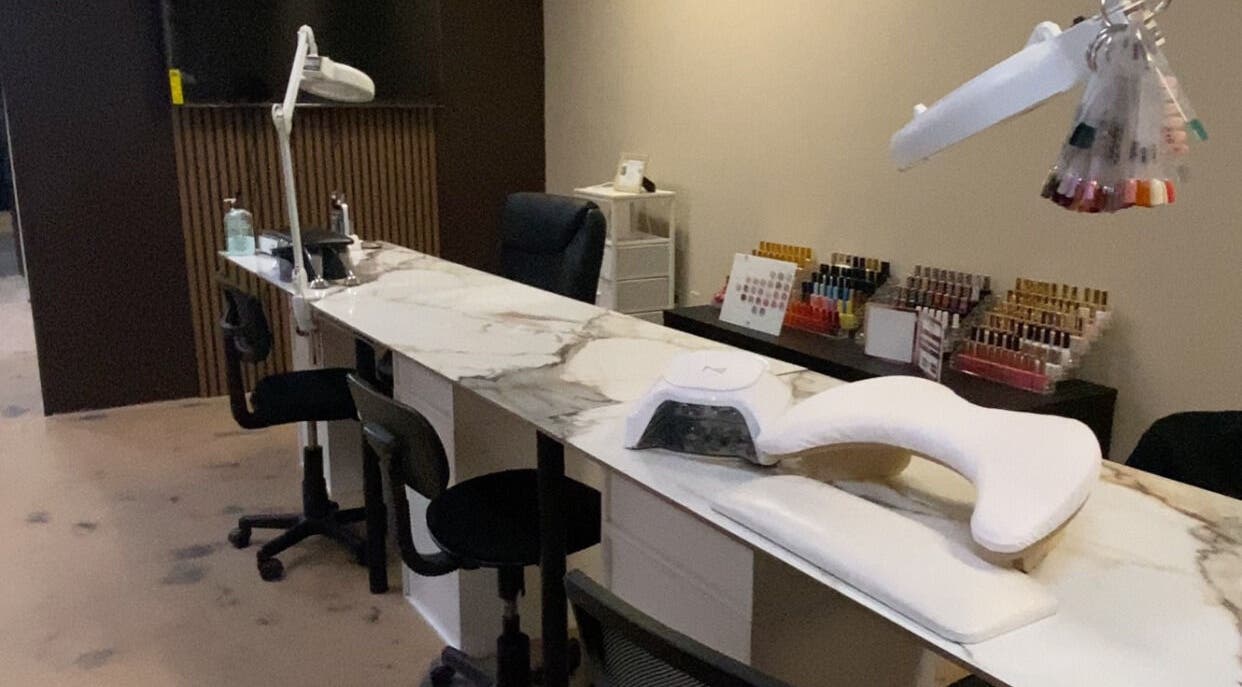Modern nail station at Sculpted by Perla in Fort Mohave, Arizona, US, showcasing a stylish and professional setup.