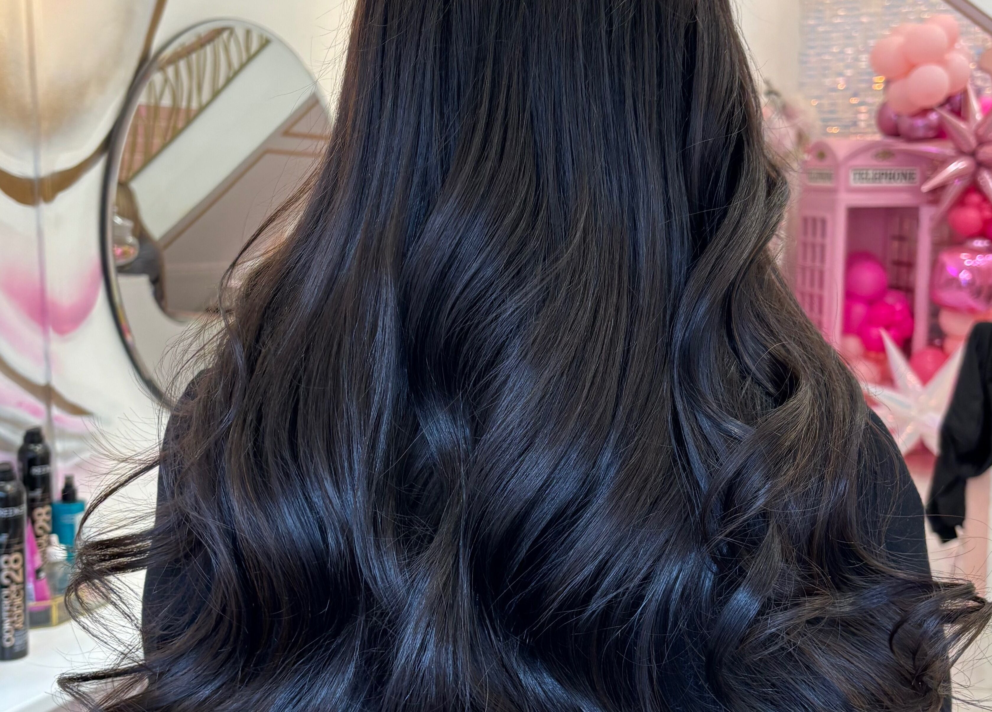 Luxurious wavy hairstyle at Dutchess Salon Glasgow in Glasgow, Scotland, GB. Perfect for elegant transformations.