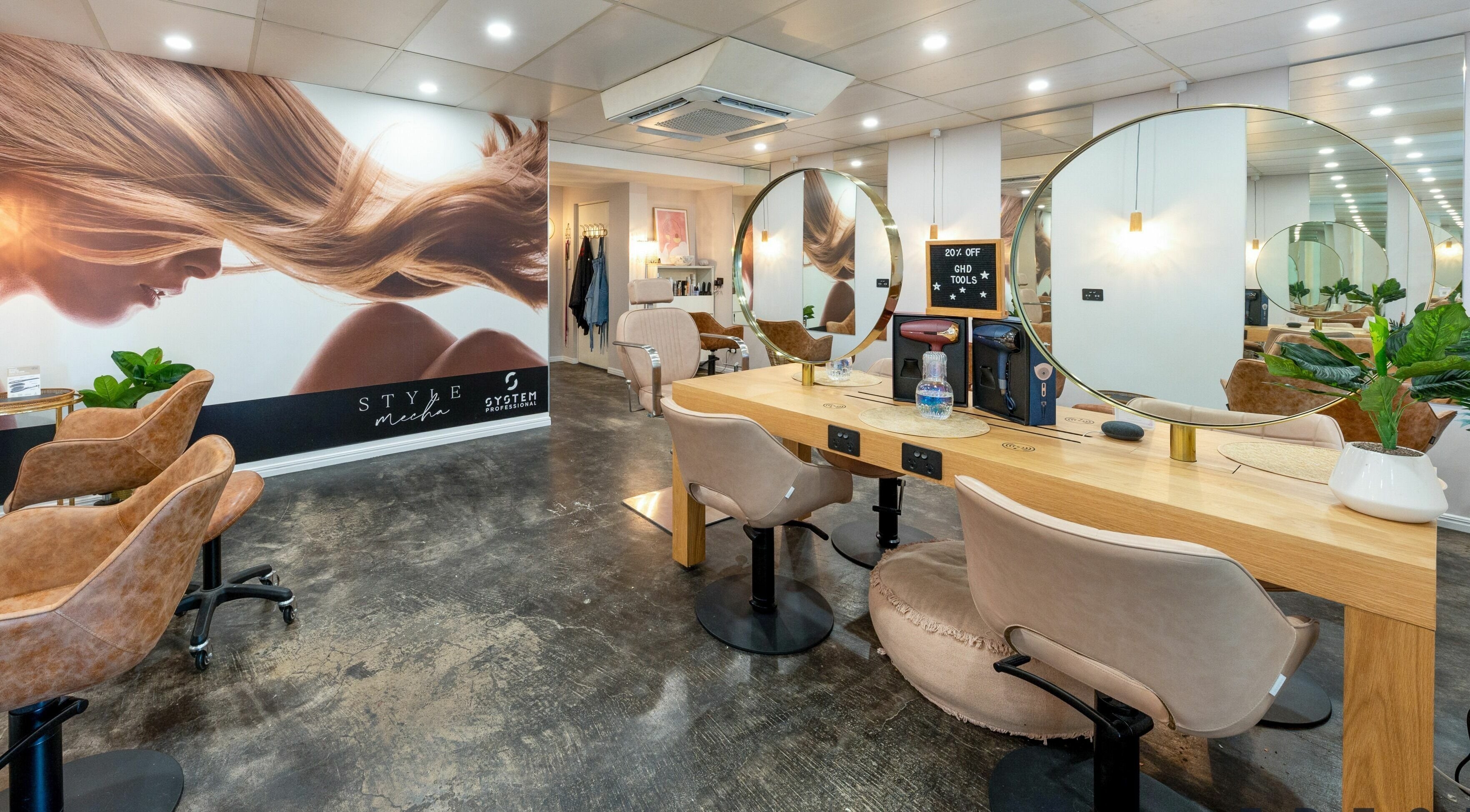 Style Mecha salon interior in Thorneside, Queensland, AU featuring elegant chairs and mirrors.