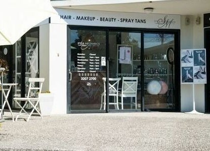 Front view of Style Mecha salon in Thorneside, Queensland, AU featuring outdoor seating and glass entrance.