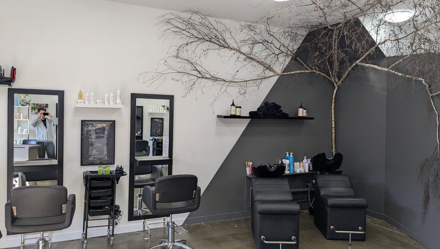 New Sensations Hairstyling in Melbourne, Victoria, AU features modern salon chairs and elegant decor.